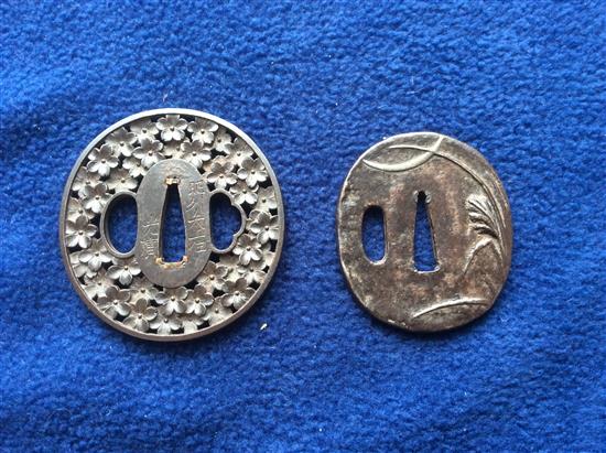 A 19th century Japanese tsuba and another